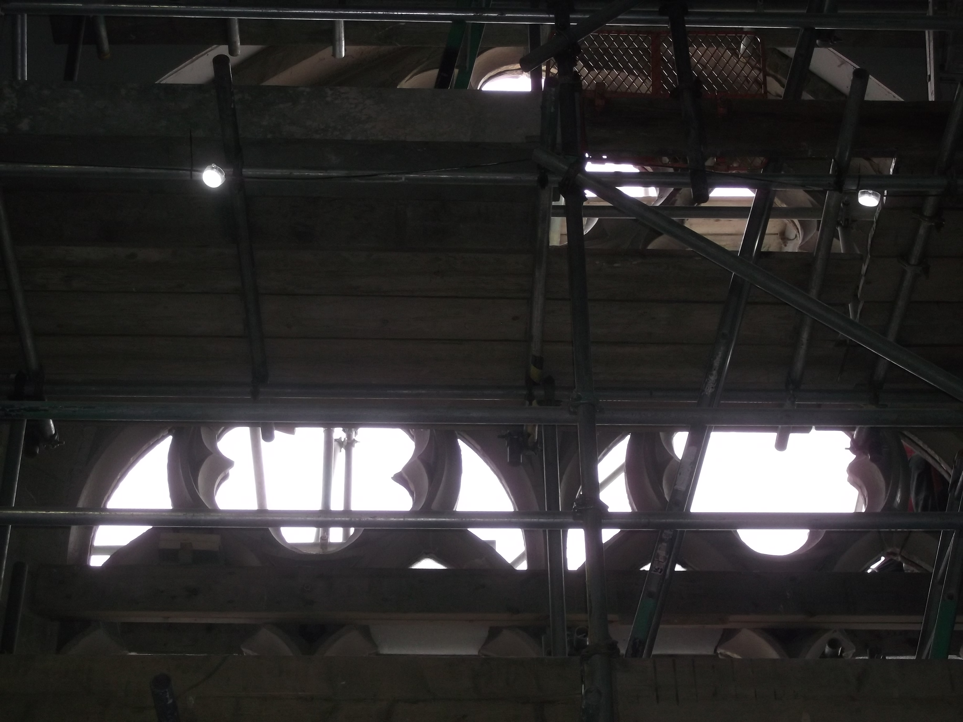 Close up of the stone tracery viewed through the scaffolding. The stonework is now restored and awaiting the return of the glass