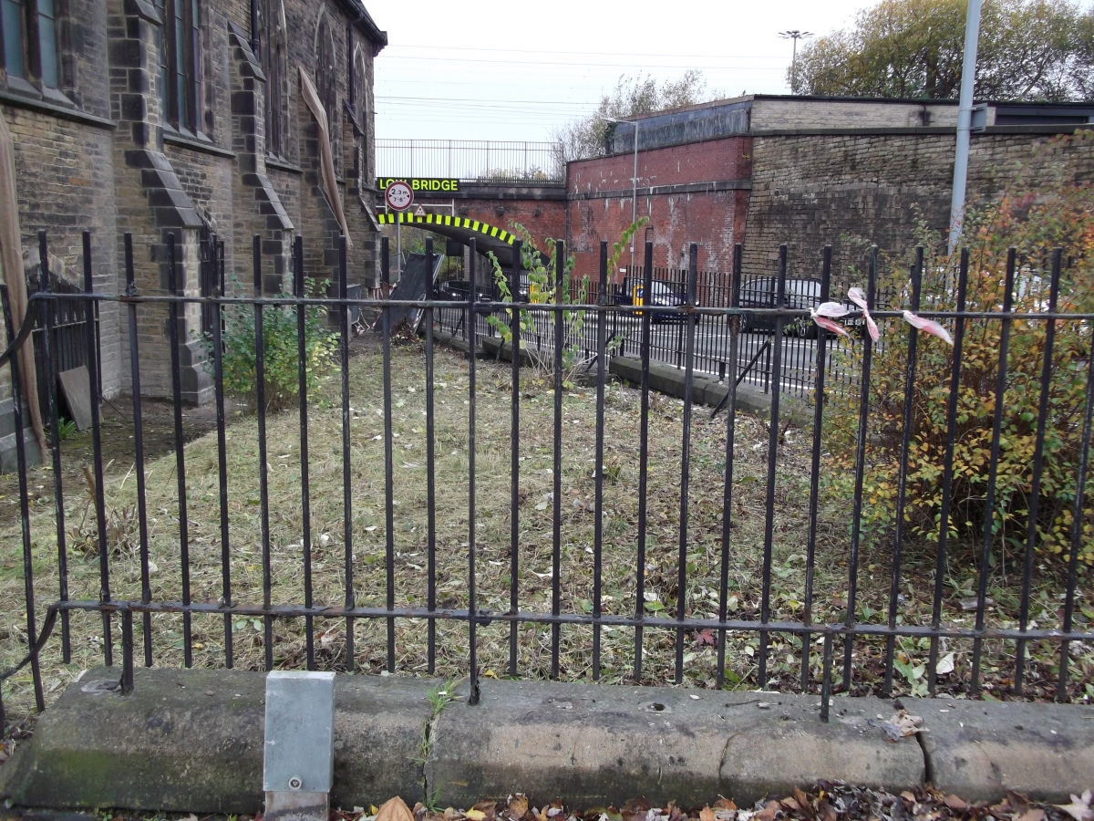 The corner plot of the church after the work - tidy and cut back