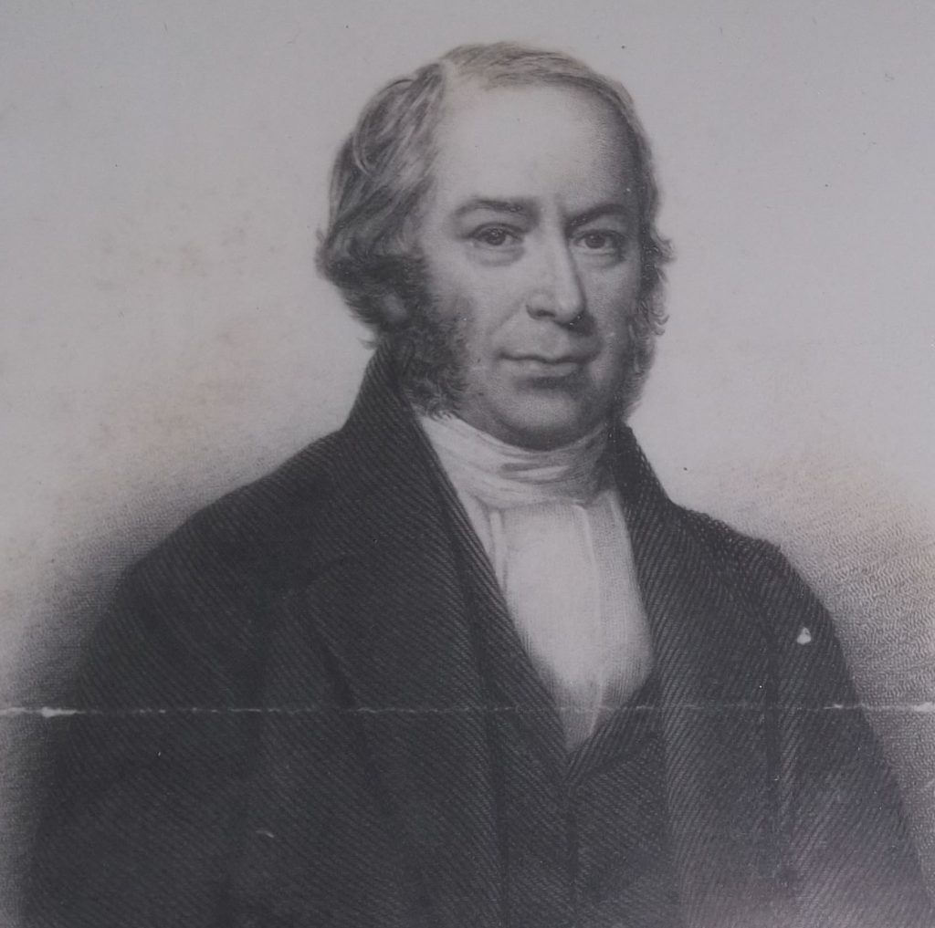 Portrait showing Rev Thornton in an early 1800s white cravat style collar. He is clean shaven with the hint of a smile