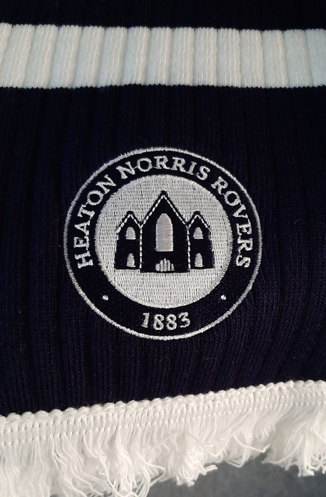 Limited Edition navy blue Heaton Norris Rovers scarf with close up of logo featuring Wycliffe Church and the date 1883
