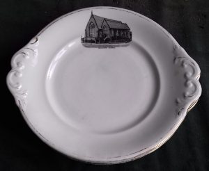 White plate with black and white etched image of Chapel in top centre