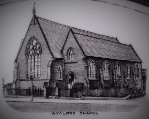 Close up of the Chapel etching on a white plate