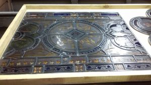 Restored stained glass in wooden box for East window