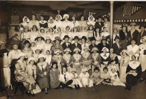 Four rows of ladies in costumes