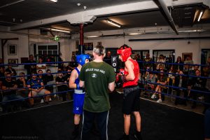 The umpire from Belle Vue ABC advises two boys before they begin sparring